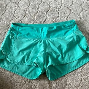 Lululemon Teal low rise speed up shorts 4” size 6
